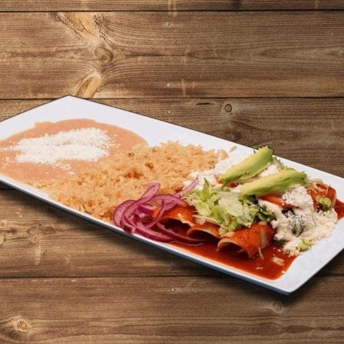 Enchiladas filled with shredded chicken, topped with red sauce and cheese in Kennewick, WA.