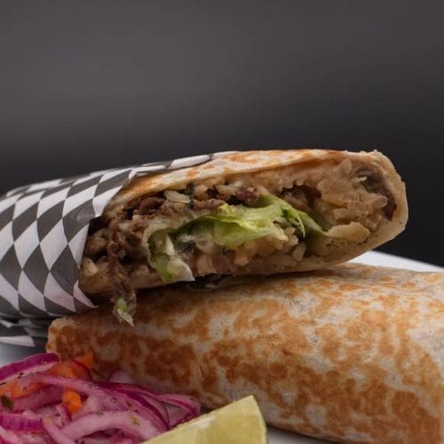 Burrito filled with grilled steak, rice, and beans in Kennewick, WA. Burrito filled with grilled steak, rice, and beans in Kennewick, WA.